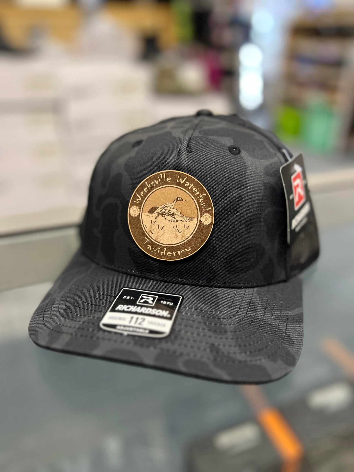 Weeksville Waterfowl Patch Hat (Black Duck Camo)